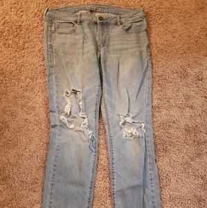 Light wash distressed skinny jeans